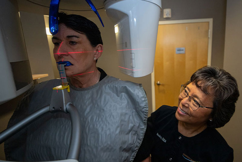 patient undergoing dental scanning device for dental procedure