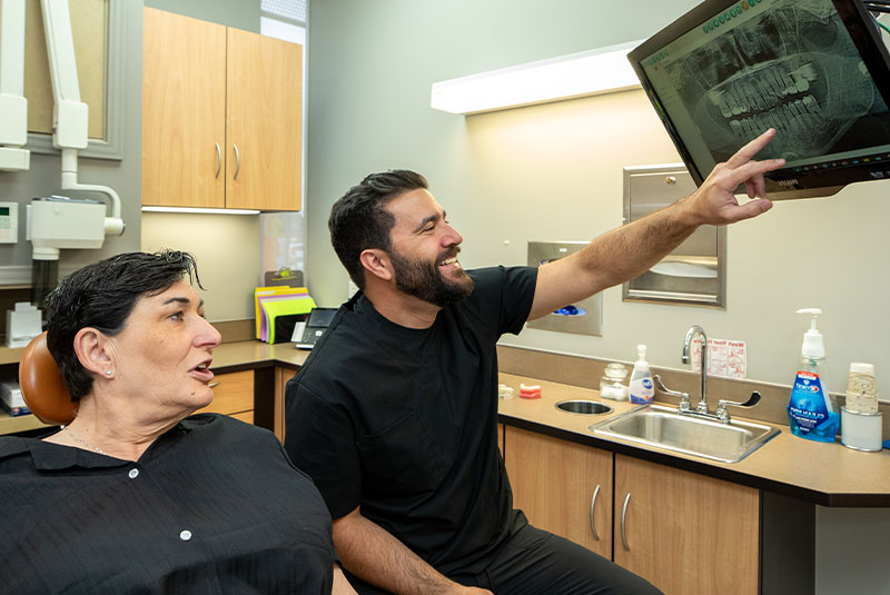 patient and doctor going over dental procedure information