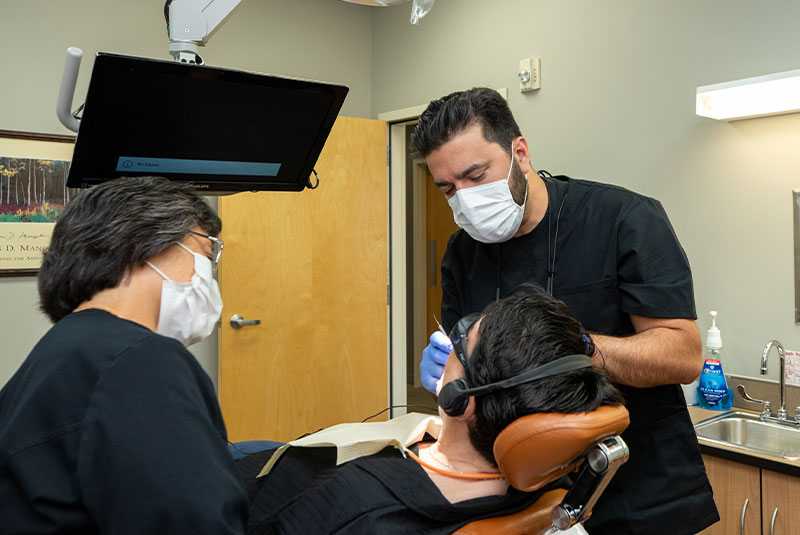 doctor performing dental procedure