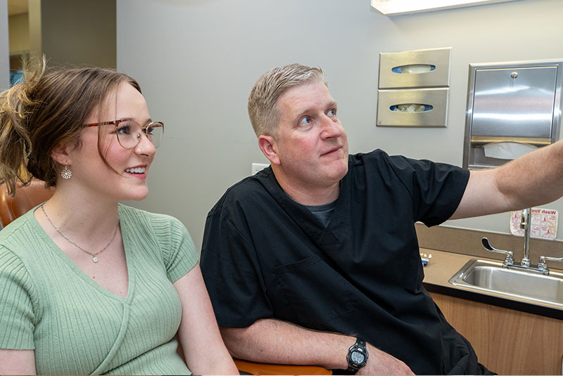 patient and doctor going over dental procedure information