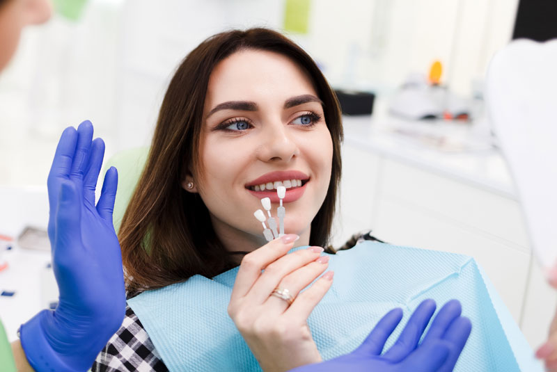 patient trying on veneers before cosmetic dental procedure