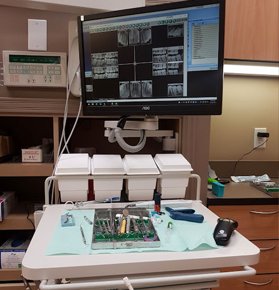 procedure room with tech and dental tools