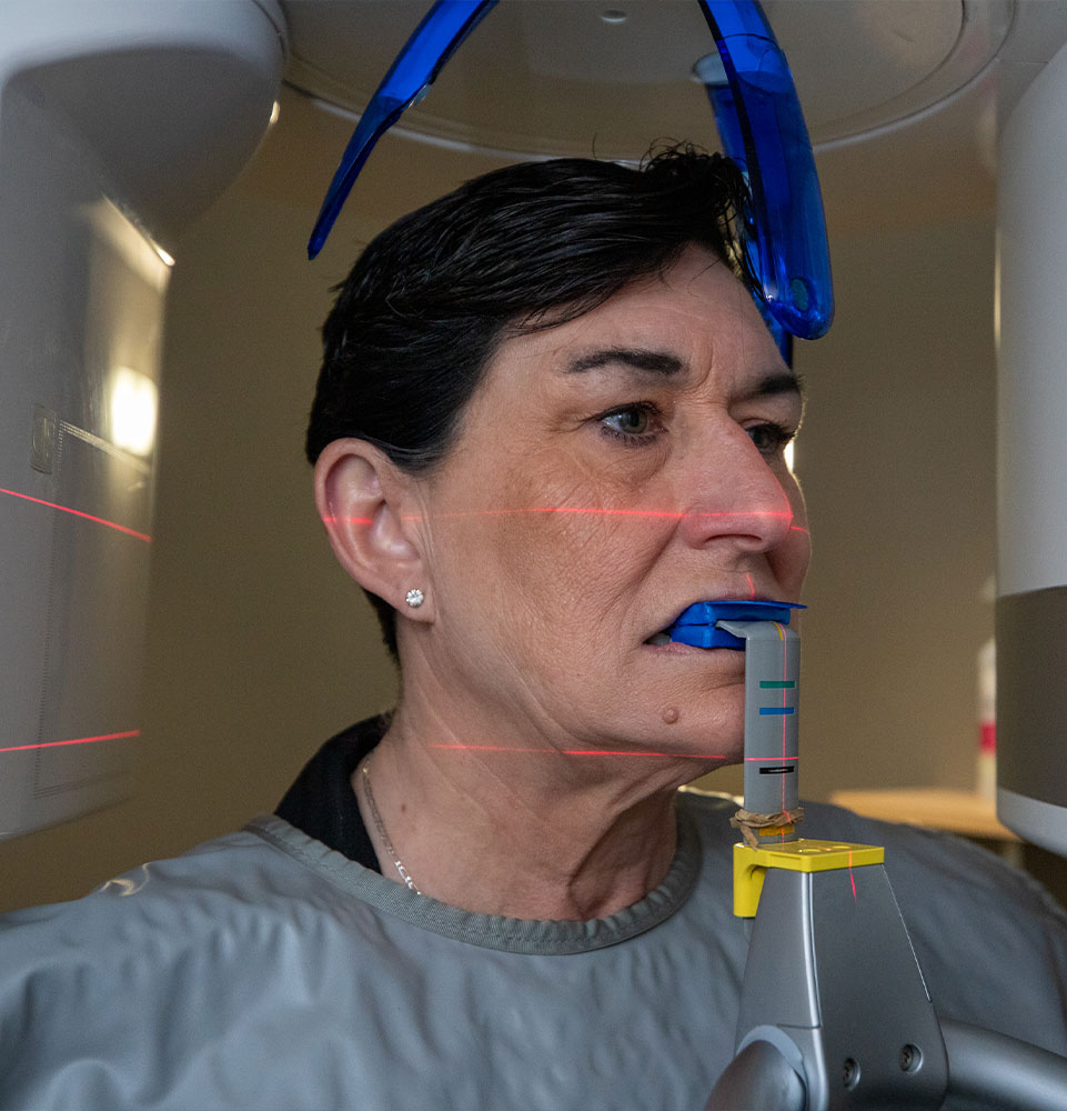 Patient undergoing 3d scanning device for dental procedure